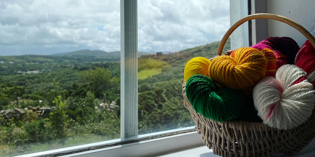 basket of yarn on window ledge