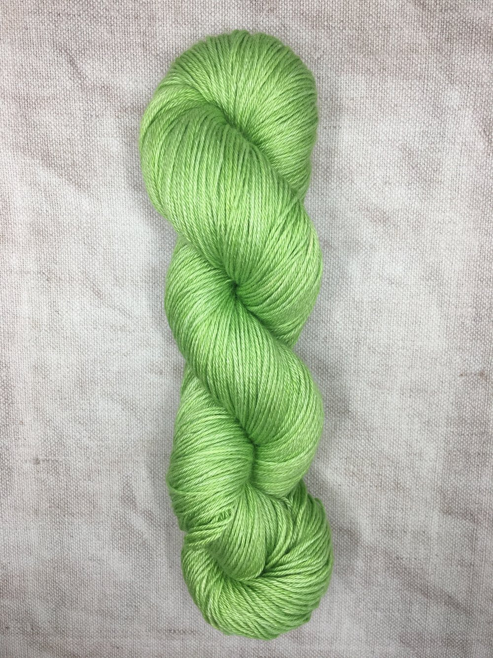 Hand dyed green silk merino wool yarn